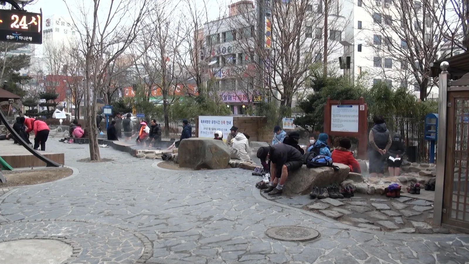 Visitors soaking their feet at the Yuseong hot-spring foot spa, Daejeon