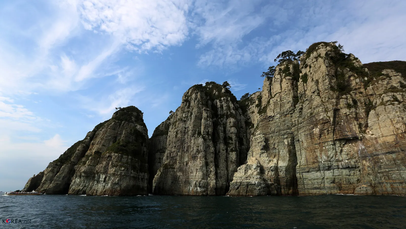 The rock cliffs of Haegeumgang rising from the sea, Geoje