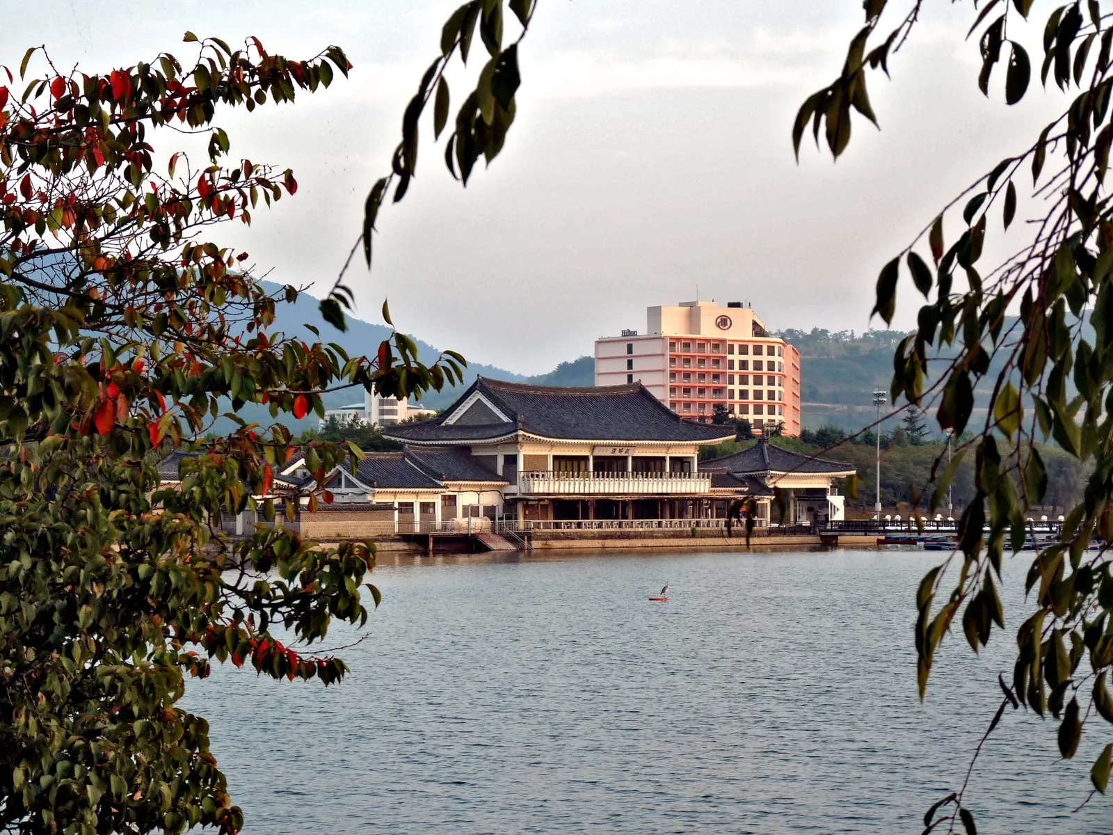 Bomun Lake in autumn, framed by turning leaves, Gyeongju