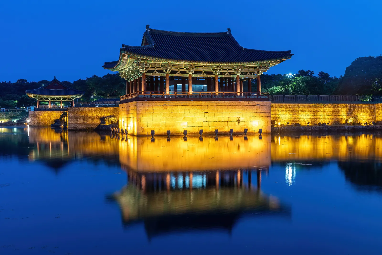 Donggung Palace lit at blue hour and reflected in Wolji Pond, Gyeongju