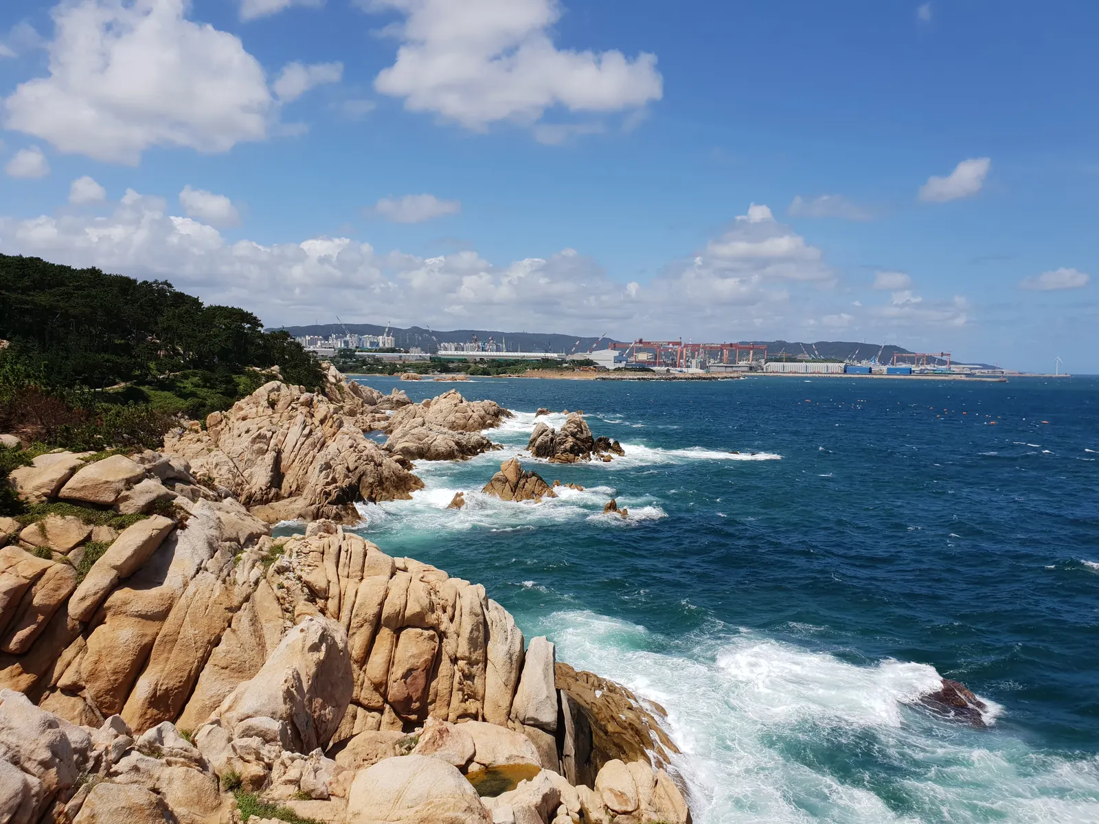 Granite rocks and surf along the coast of Daewangam Park, Ulsan