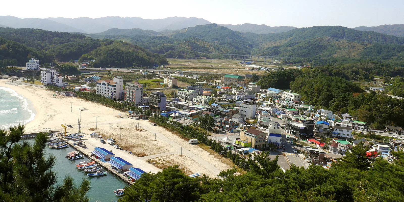 Ingu Beach, its small port and the village behind it, Yangyang